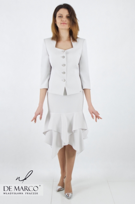 A modern, original suit with a pencil skirt and a frill. Stylish costumes for business women