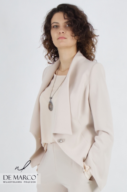 Fashionable formal set with trousers. A beige set of trousers, a jacket and a formal blouse from the designer