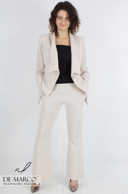Fashionable women's suit for conferences. Ladies' beige pantsuit with loose lapels