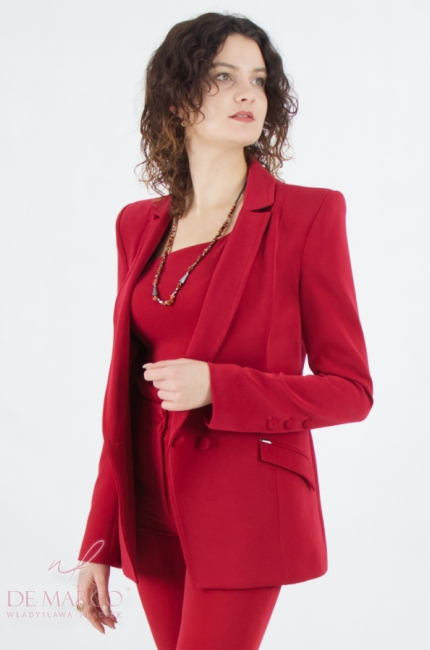 A beautiful women's suit with an asymmetrical blouse in ruby red. Tailor made by designer De Marco