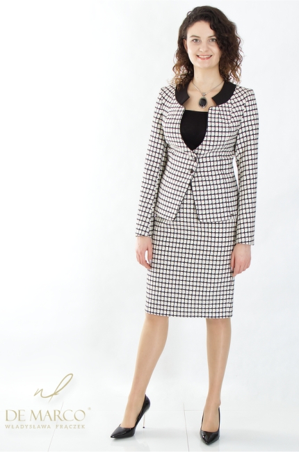 An original set of a jacket with a skirt for business women. Fashionable checkered business suit in black and white. Tailor made by De Marco