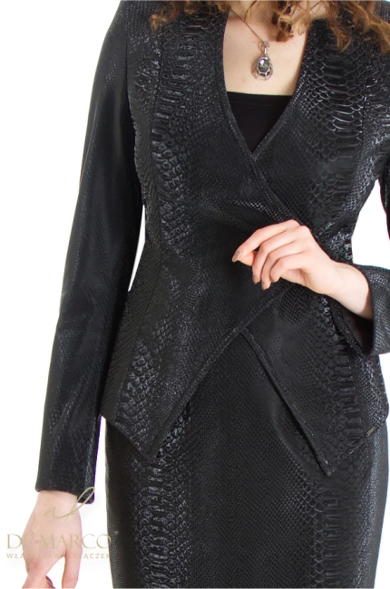 A sophisticated women's costume, a formal set of a jacket with a skirt made of eco leather. Fashionable sets made of eco leather for conferences, galas and public speeches. Polish producer De Marco