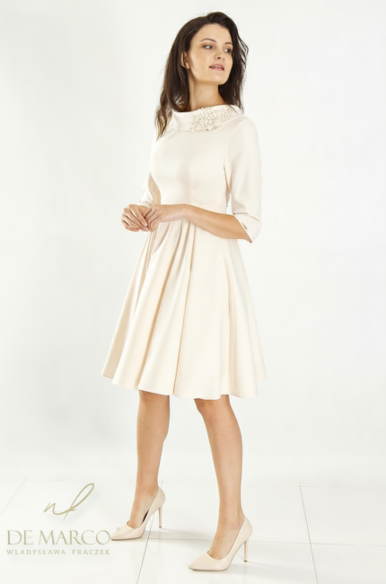 An elegant, cream, flared dress perfect for a wedding, anniversary, First Communion, or First Communion. Custom-tailored by designer tailor De Marco.